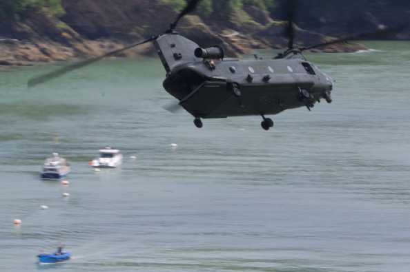 07 July 2020 - 12-40-39
There is a 'rear-gunner', but he or she is hiding in the gloom.
----------------------------
RAF Chinook ZA704 low flypast of Dartmouth